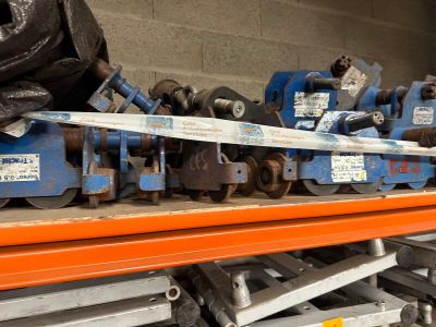many different types of tools on a shelf in a warehouse