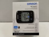 an image of an omron blood pressure monitor sitting on a table