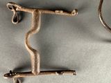 a metal hook that is attached to a wall