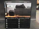 a black box with a picture of a music system on it