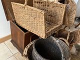 a basket that is sitting on the floor next to other baskets