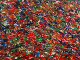 abstract painting of red, green, blue, and black paint on a white background