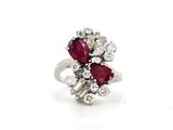 an image of a diamond and ruby ring on a white background