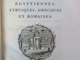 an old book with a drawing of a building on it
