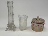 three glass vases sitting next to each other on a table