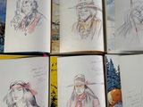 several sketches of people in native clothing are shown in an open book