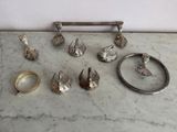 a marble table with a bunch of silver objects on it