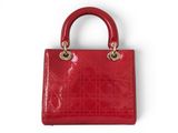a red handbag on a white background