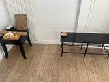 a black desk and a black chair in a room