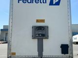 the back of a delivery truck parked in a parking lot