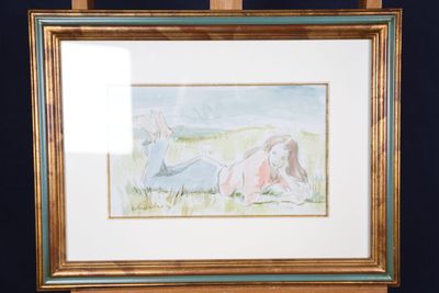 aquarelle encadrée représentant une femme allongée dans l'herbe
