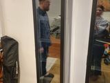 a man taking a picture of himself in the mirror