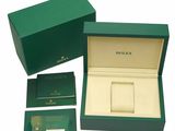 an image of a green box with a watch inside of it