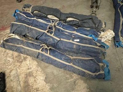 a pile of luggage sitting on the floor in a room