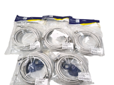 six different types of cables in bags on a white surface