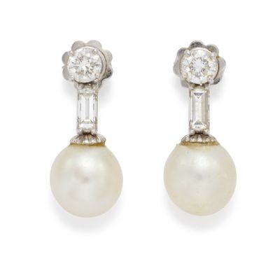 a pair of pearl and diamond earrings
