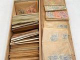 a wooden box with many different types of stamps in it
