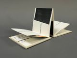 a folded book with a black and white picture on it