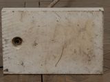 a white box with a hole in it sitting on the floor