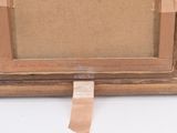 an image of a picture frame with tape taped around it