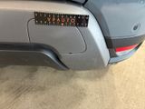 a close up of a sticker on a car ' s bumper
