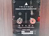 a close up of a metal panel with a speaker on it