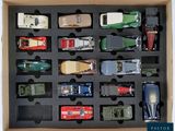 many toy cars in a box that are in a box