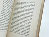 an open book on a white table with a white background