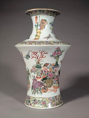 a vase with a painting on it sitting on a table