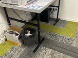 a computer desk with a printer on top of it