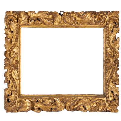 an old gold frame with a decorative design on a white background
