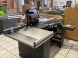 an image of a kitchen with a counter and a computer on it