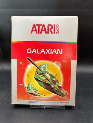 an image of a box of atari ' s galaxyan on a table