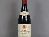 a bottle of wine that is sitting on a table