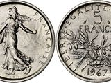 a coin with the image of a woman in a dress on it