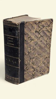 an old book that is sitting on top of a table