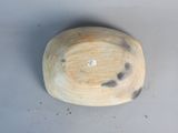 a wooden bowl that has a diamond in the middle of it
