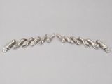 a pair of sterling silver bracelets