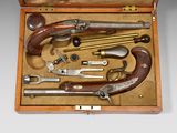 a wooden box with a bunch of different tools in it