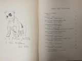 an open book with a drawing of a dog sitting on top of a table