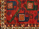 an image of a red and blue area rug with geometric designs