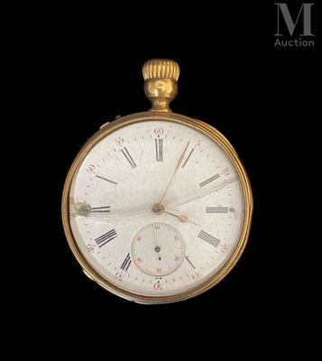 a gold pocket watch with roman numerals on the face