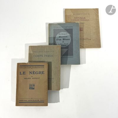 several books are stacked on top of each other on a white surface
