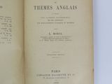 an open book on a white table with a black and white title