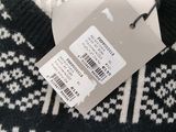 a label on a sweater that says fursaa