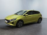 a yellow car parked in a room with a white wall
