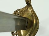 a close up of a metal object with a knife in it