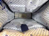 a close up of a bag with a tag on it