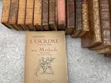 many old books sitting on the floor next to each other