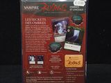 the back cover of a box of vampire cards on a black surface
